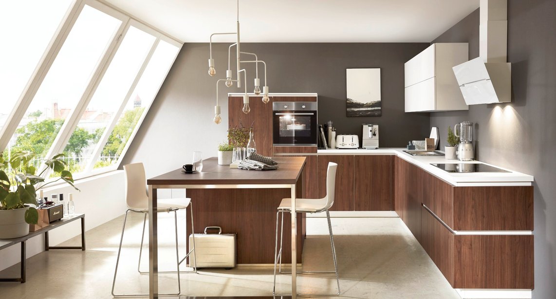 A renovation done right — this walnut and white kitchen shows what's possible when you find the right contractor for the job.
